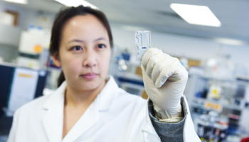 NGS Scientist Looking At Slide