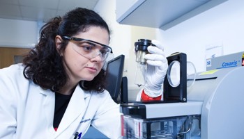 NGS Scientist Inserting Tube Holder Into The Covaris